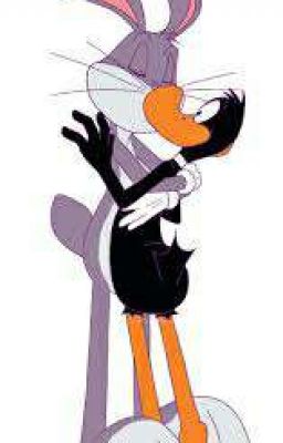 Bugs kisses Daffy to shut him up.